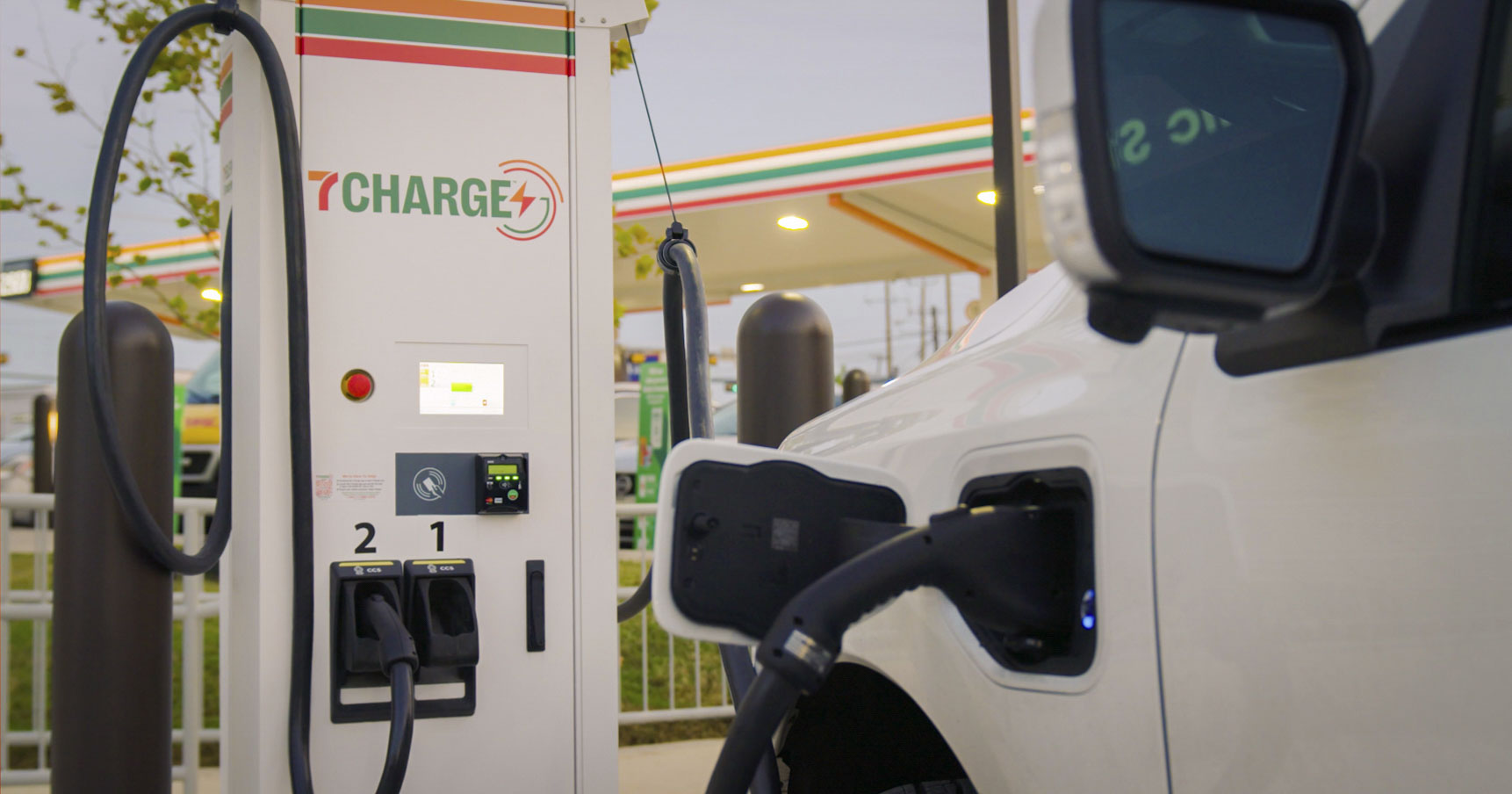 Picture of car charging at a 7-11 7Charge charing station. 